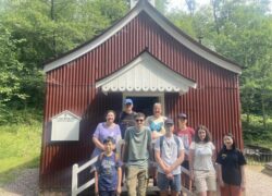 Group of Young People outside a tin hut chapel