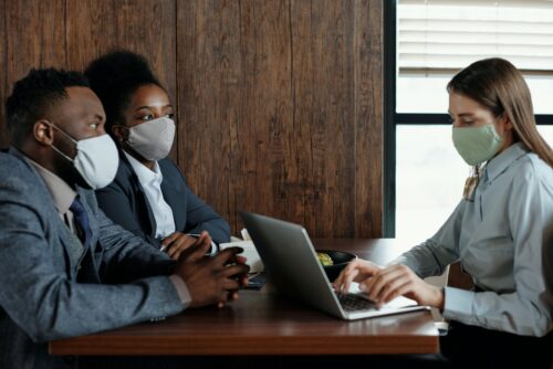 Interview at a desk with masks on