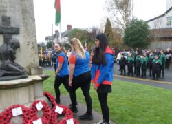 Guides placing their wreath at the Radyr War Memorial